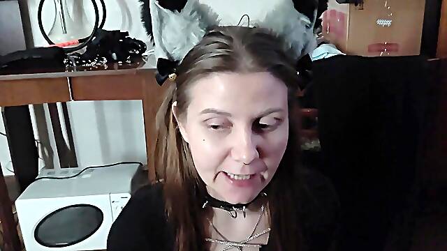 Sexy kitty eats from a bowl and licks her masters feet -