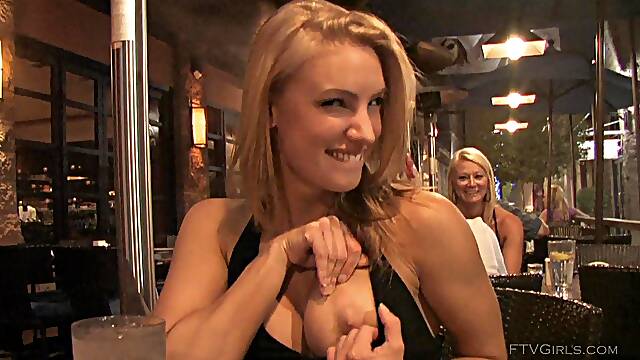 Anne is a blonde beauty who reveals her big boobs in public.