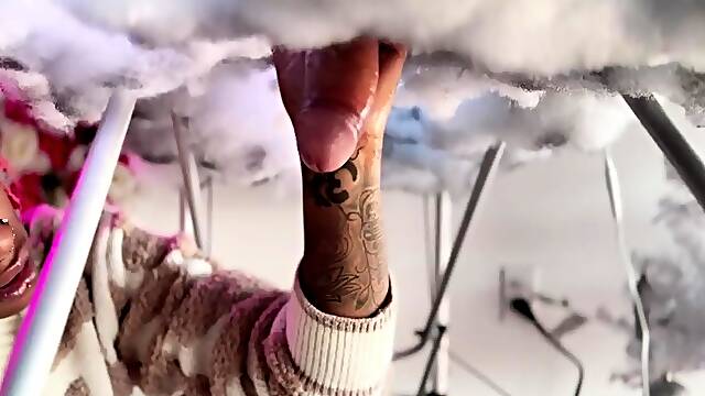 Pierced and tattooed boy sucking black cock from glory hole