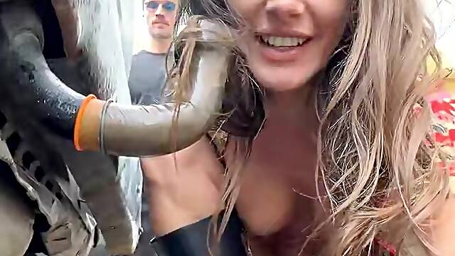 Busty MILF in Red Boots Sucks Truck Pipe in Public