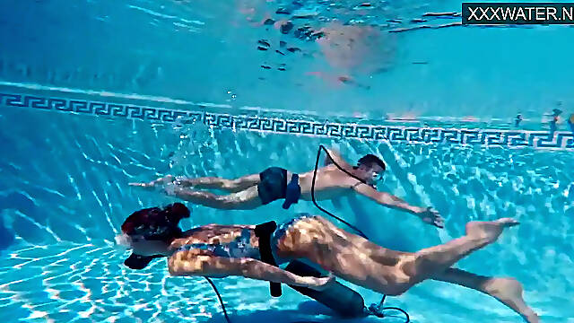 Brunette teen gives hot underwater blowjob