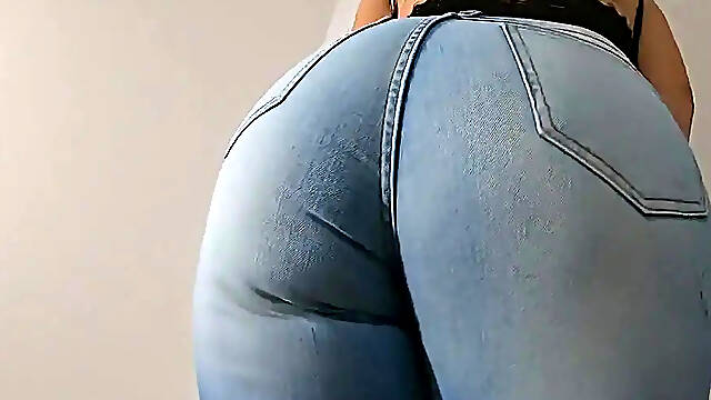 Sensual Latina milf in tight jeans flaunting her big boobs and sexy cameltoe