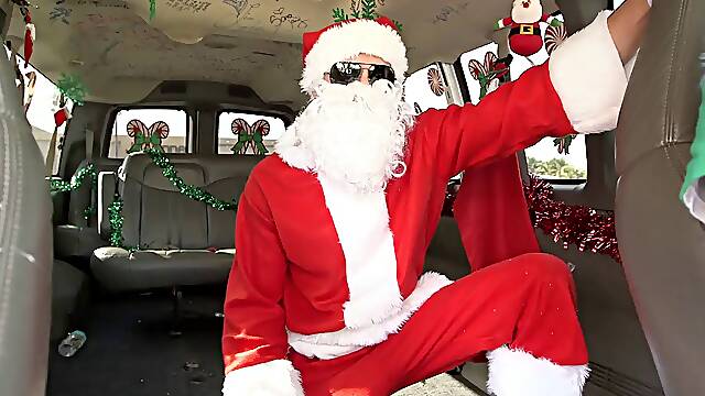 A bad girl gets fucked by Santa in the back of a van
