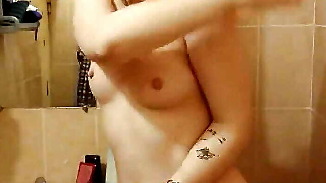 Sexy striptease and masturbation in the shower with a wild orgasm. Close-up