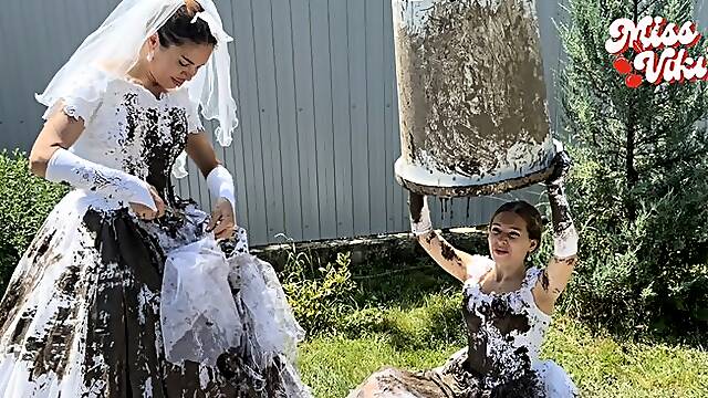 Two brides in mud and ripping wedding dresses! Smoking!