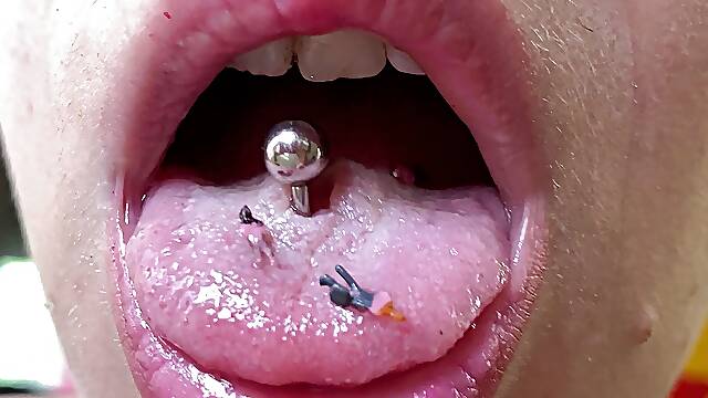 Mouth fetish giantess with model train people extreme close up