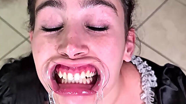 French Maid Tries to Swallow Her Own Piss Through Lip Retractor